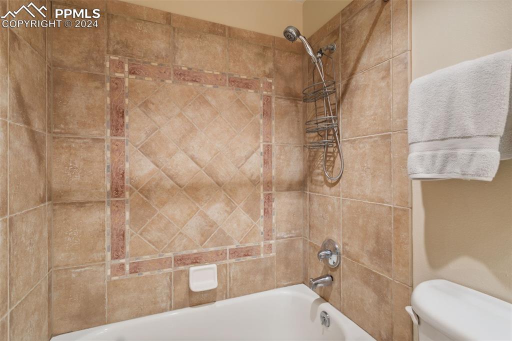 175 West Cheyenne Road, Unit 214 Colorado Springs, CO 80906 - Photo 17 of 28 a bathroom with a bathtub and shower