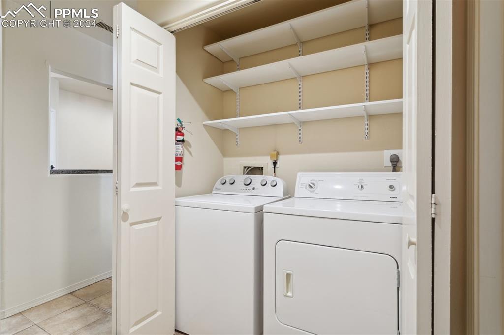 175 West Cheyenne Road, Unit 214 Colorado Springs, CO 80906 - Photo 18 of 28 a utility room with dryer and washer