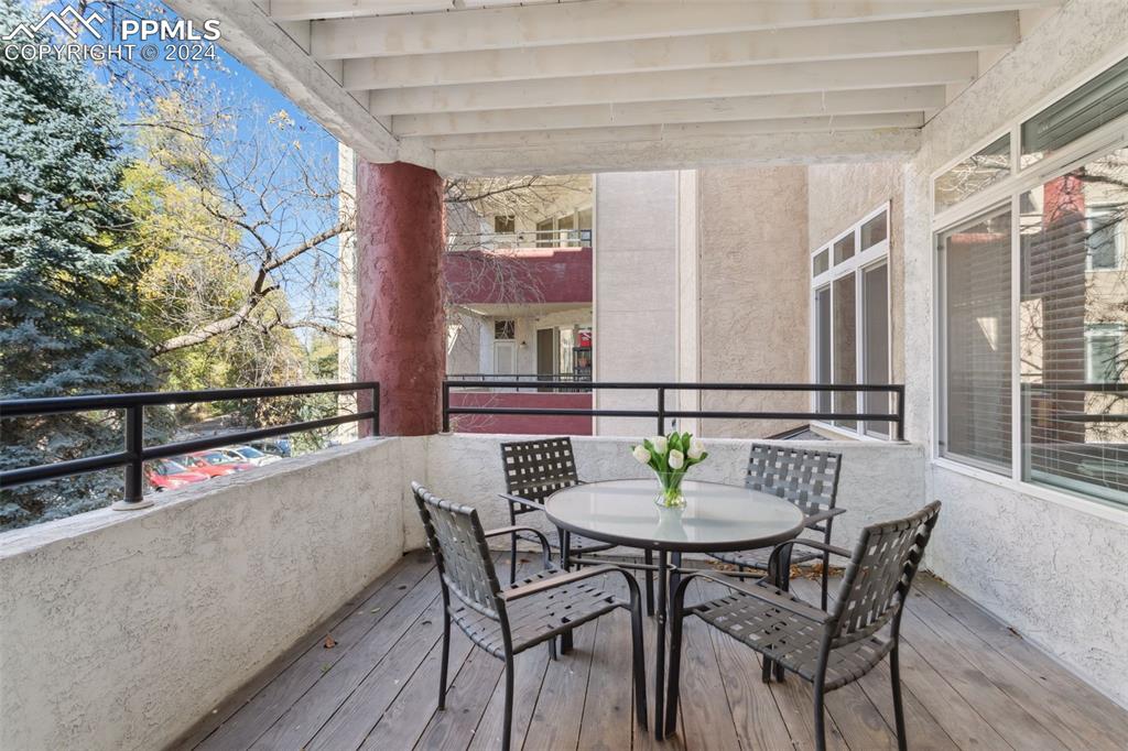 175 West Cheyenne Road, Unit 214 Colorado Springs, CO 80906 - Photo 19 of 28 a view of a dining table and chairs in the balcony