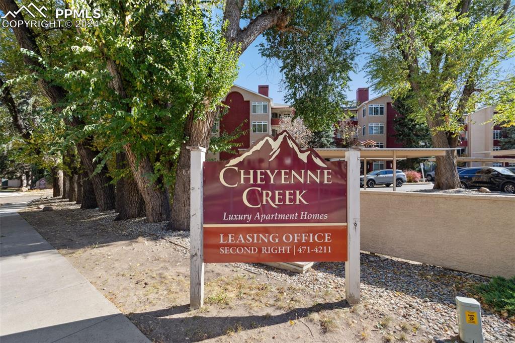 175 West Cheyenne Road, Unit 214 Colorado Springs, CO 80906 - Photo 25 of 28 a sign on the side of a road