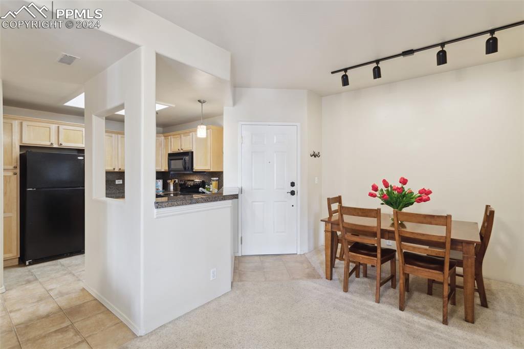 175 West Cheyenne Road, Unit 214 Colorado Springs, CO 80906 - Photo 9 of 28 a view of a dining room with furniture