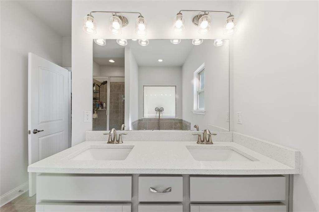 1861 Abbey Road Griffin, GA 30223 - Photo 12 of 26 a bathroom with a sink double vanity and a mirror
