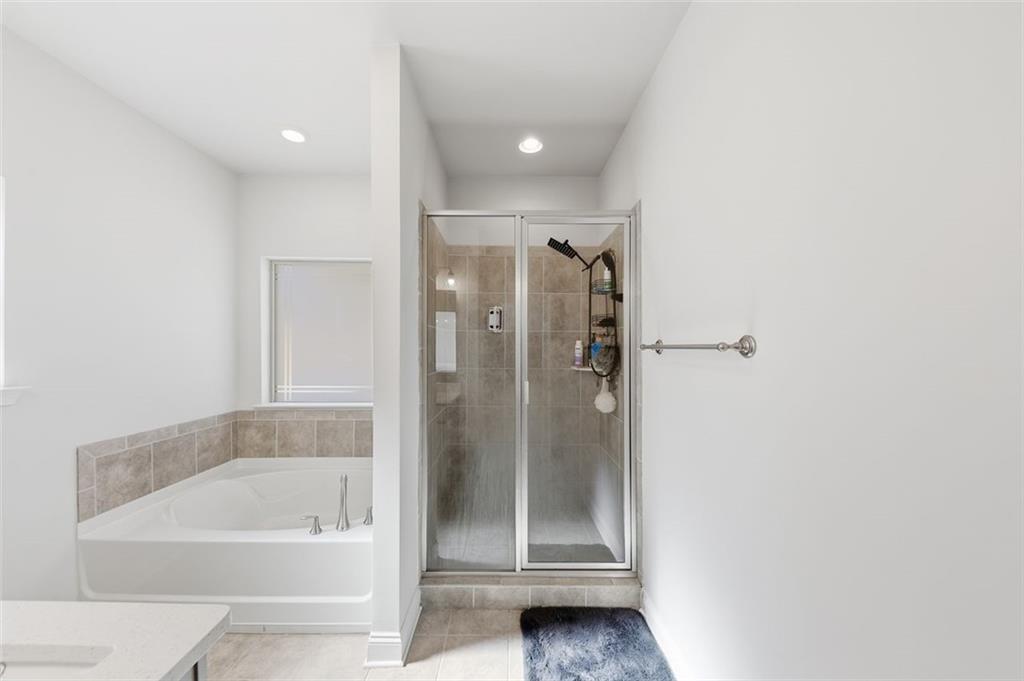 1861 Abbey Road Griffin, GA 30223 - Photo 13 of 26 a bathroom with a tub shower and toilet