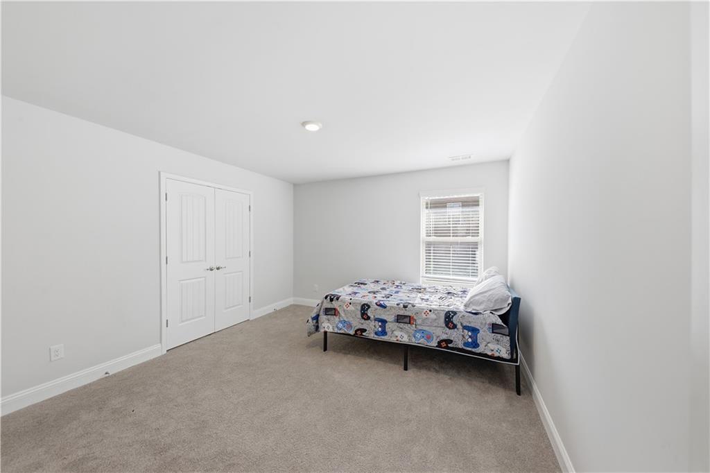 1861 Abbey Road Griffin, GA 30223 - Photo 19 of 26 a bedroom with bed and window