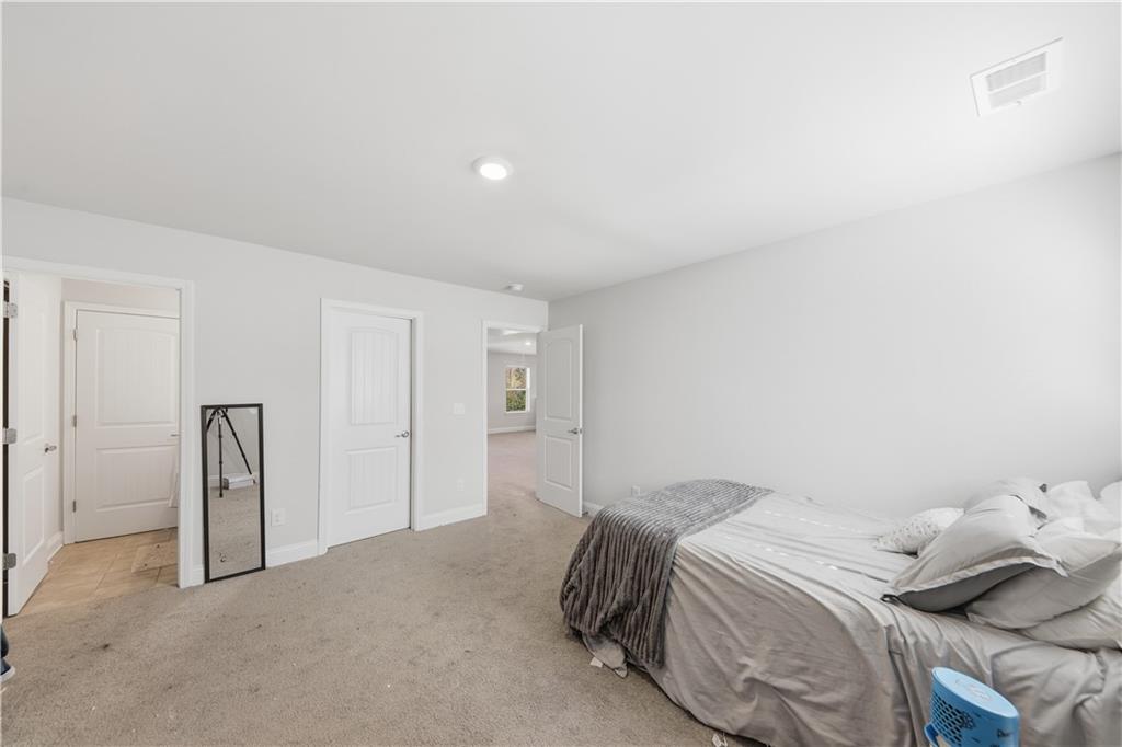 1861 Abbey Road Griffin, GA 30223 - Photo 20 of 26 a bedroom with a bed and a cabinets