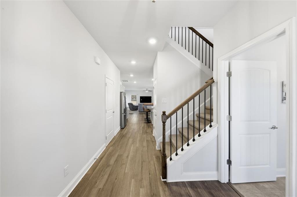 1861 Abbey Road Griffin, GA 30223 - Photo 2 of 26 a view of staircase with wooden floor and white walls