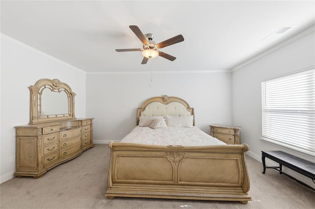 1861 Abbey Road Griffin, GA 30223 - Photo 9 of 26 a bedroom with a bed and window