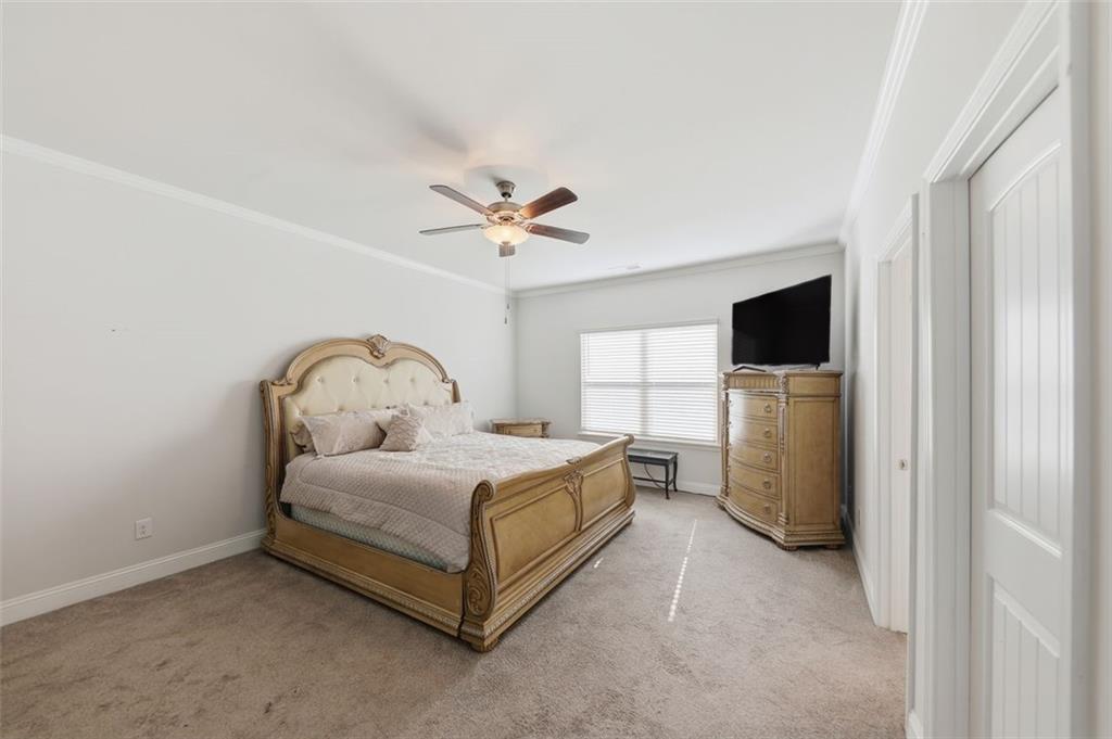 1861 Abbey Road Griffin, GA 30223 - Photo 10 of 26 a bed room with a bed and a television