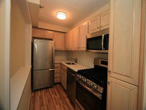 1035 East Boston Post Road, Unit L6 Mamaroneck, NY 10543 - Photo 1 of 1 a kitchen with a refrigerator stove and microwave