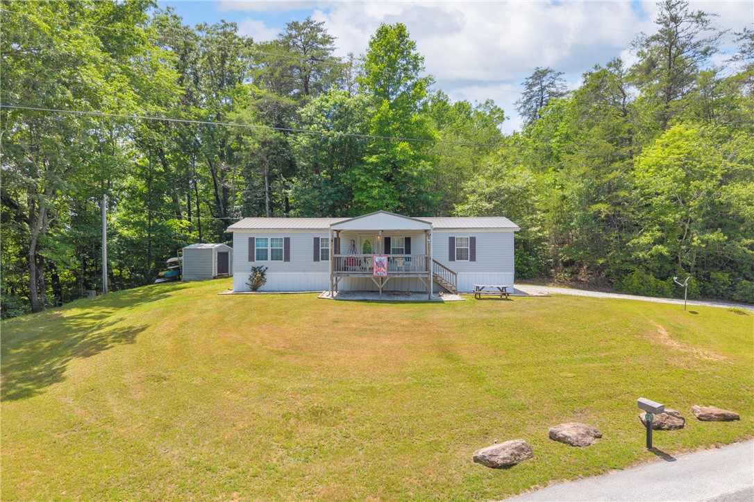 334 Lake Becky Road Mountain Rest, SC 29664 - Photo 38 of 46 A welcoming front porch and detached shed provide convenience on this private, wooded lot.