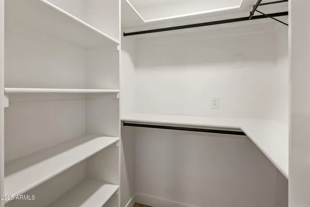a view of an empty walk in closet