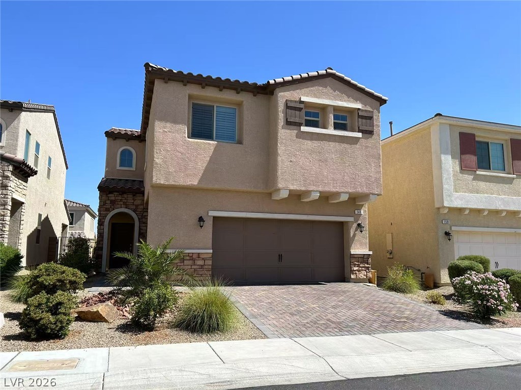 146 Tree Shot Court Las Vegas, NV 89113 - Photo 1 of 18 A stucco exterior with stone accents and a paver driveway creates compelling curb appeal.