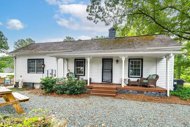 a backyard of a house with seating space