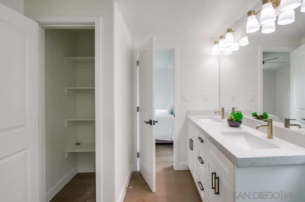 1120 Pepper Drive, Unit 78 El Cajon, CA 92021 - Photo 11 of 16 a bathroom with a double vanity sink and a mirror