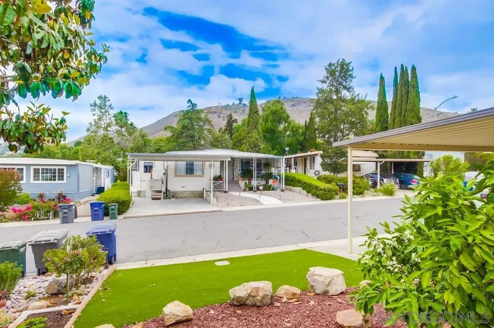 1120 Pepper Drive, Unit 78 El Cajon, CA 92021 - Photo 16 of 16 a front view of a house with garden