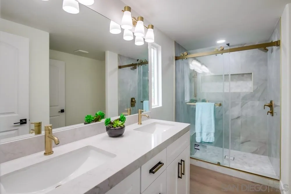 1120 Pepper Drive, Unit 78 El Cajon, CA 92021 - Photo 10 of 16 a bathroom with a sink and a mirror with bathtub