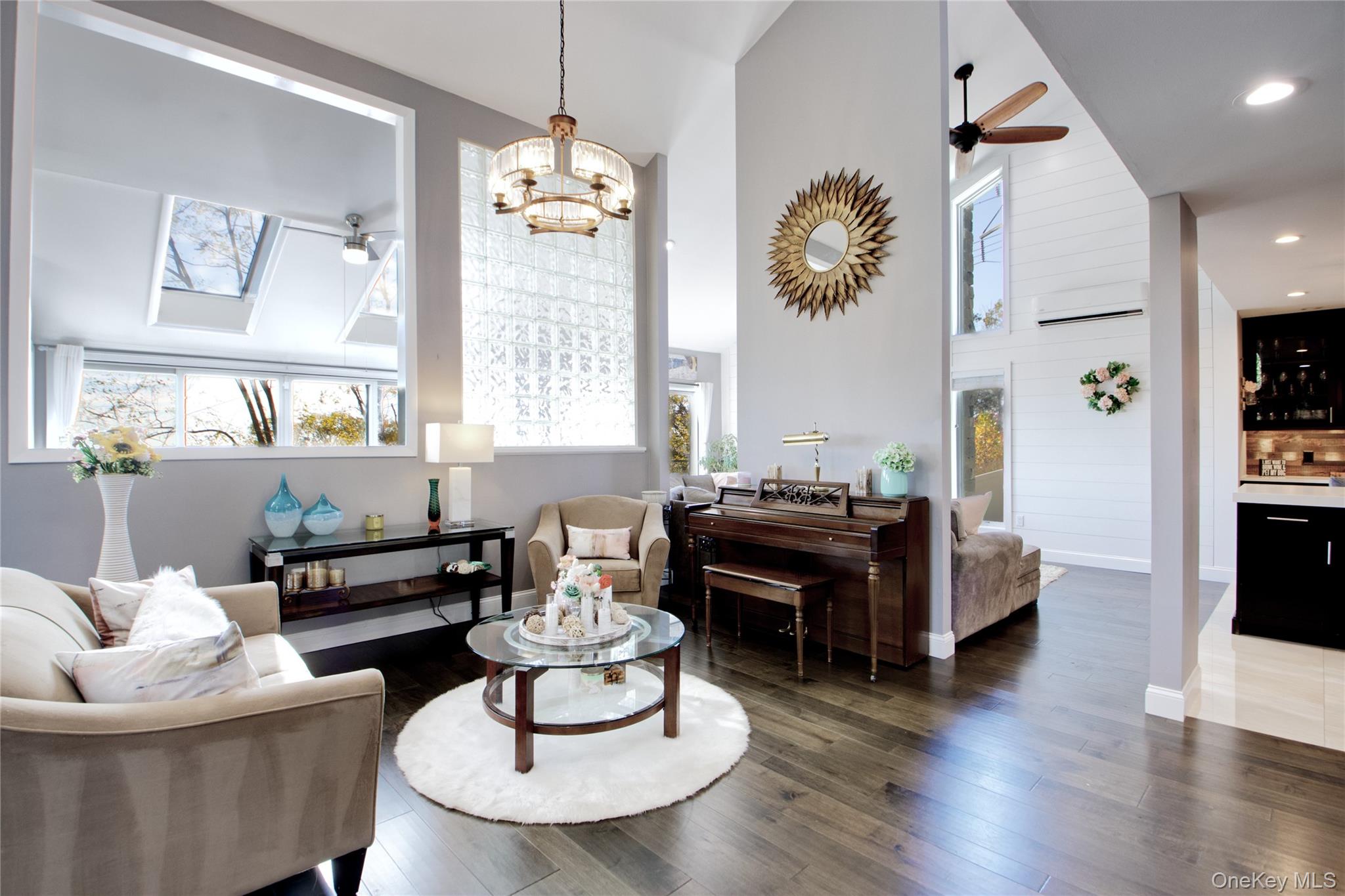 26 Summit Cir Drive Mahopac, NY 10541 - Photo 10 of 32 a living room with furniture chandelier and a window