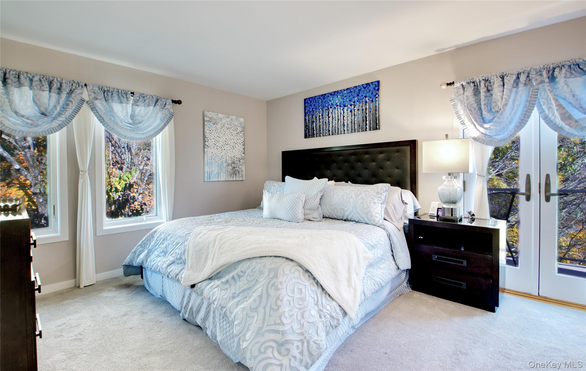 26 Summit Cir Drive Mahopac, NY 10541 - Photo 18 of 32 a bedroom with a bed and a chandelier