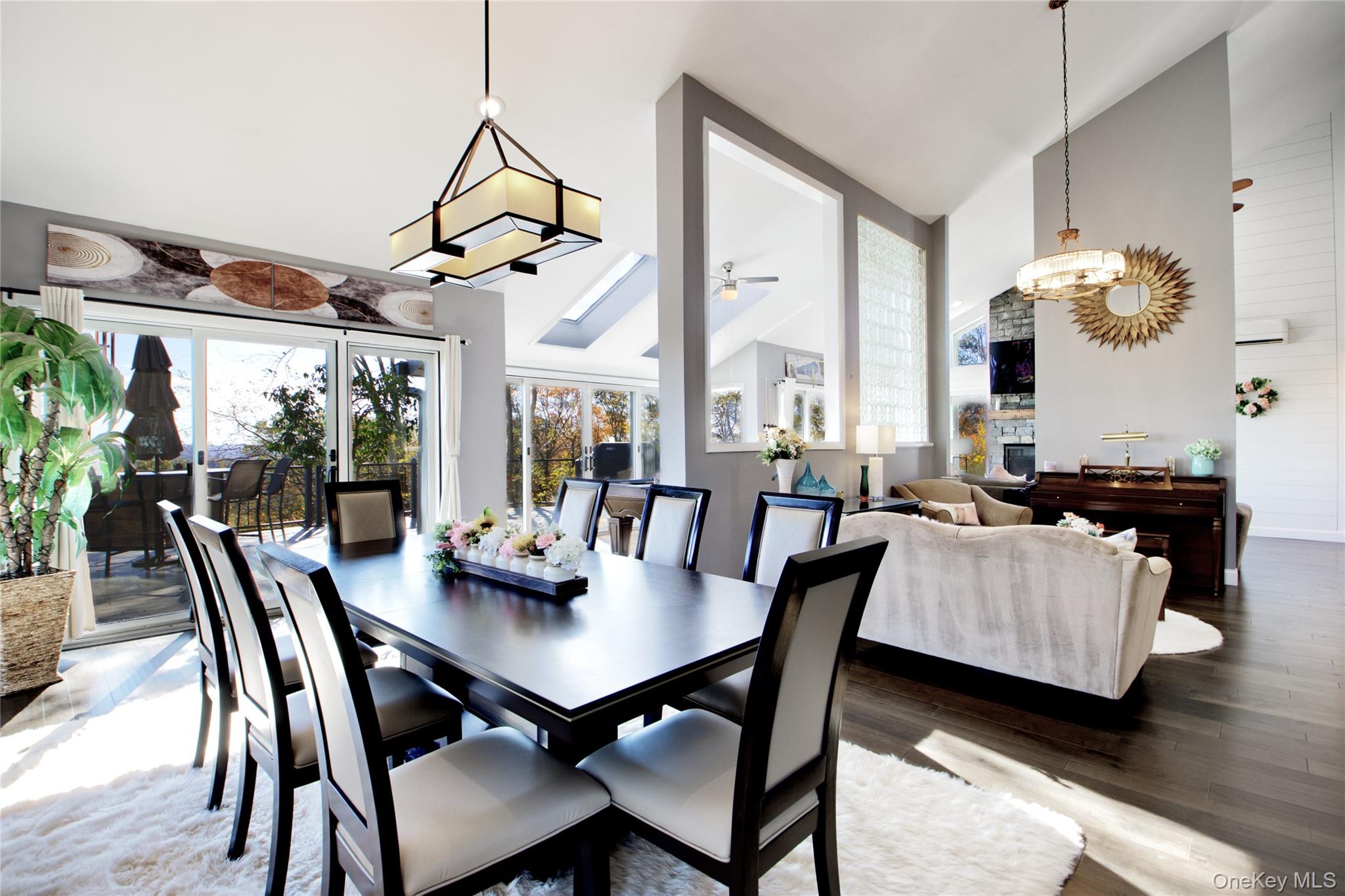26 Summit Cir Drive Mahopac, NY 10541 - Photo 7 of 32 a view of a dining room with furniture wooden floor and chandelier