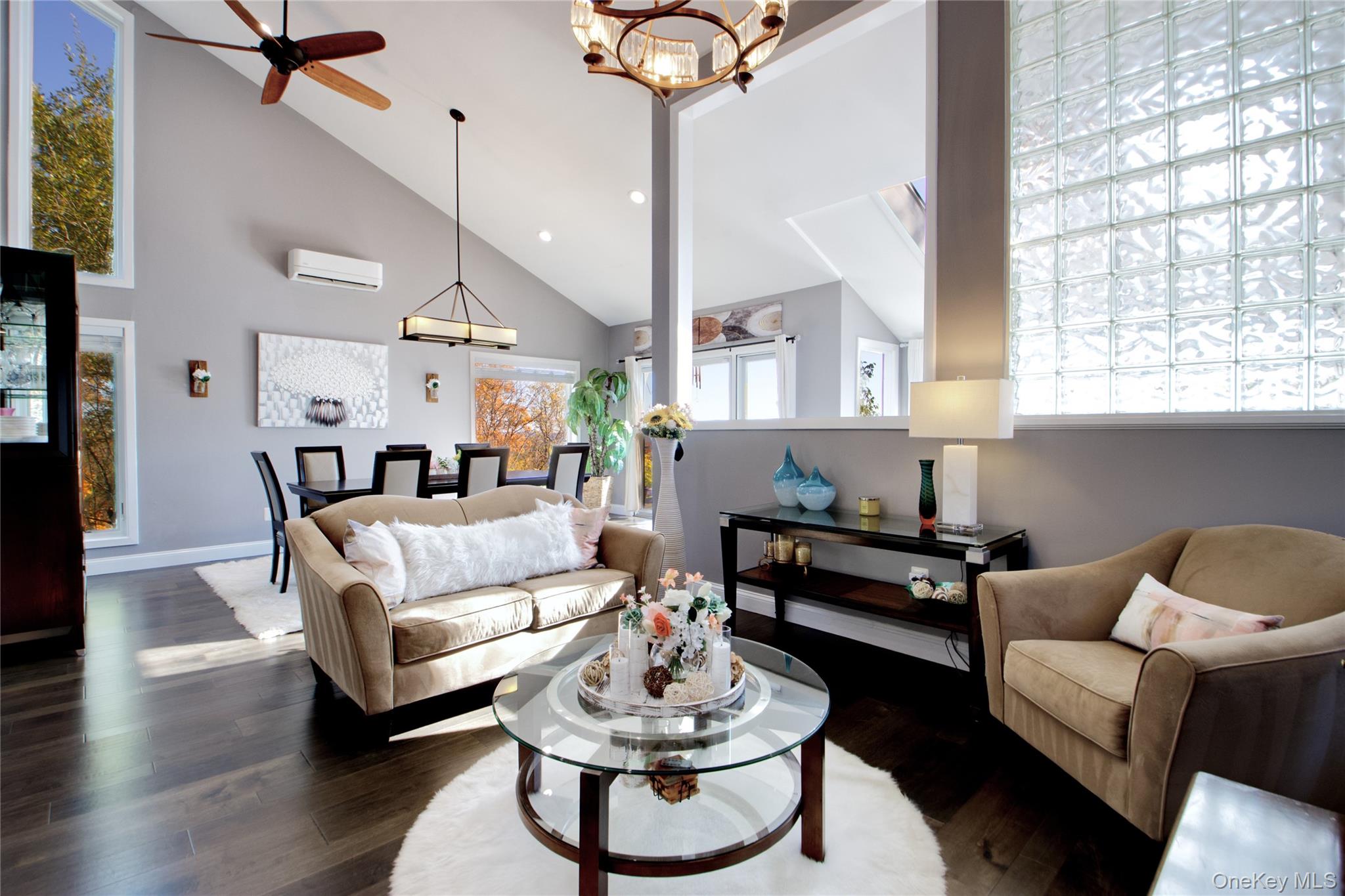 26 Summit Cir Drive Mahopac, NY 10541 - Photo 9 of 32 a living room with furniture a dining table and a large window