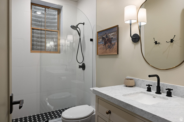 558 West Rheinfalls Circle Midway, UT 84049 - Photo 45 of 61 Walk-in shower with clear glass enclosure and black and white patterned tile flooring