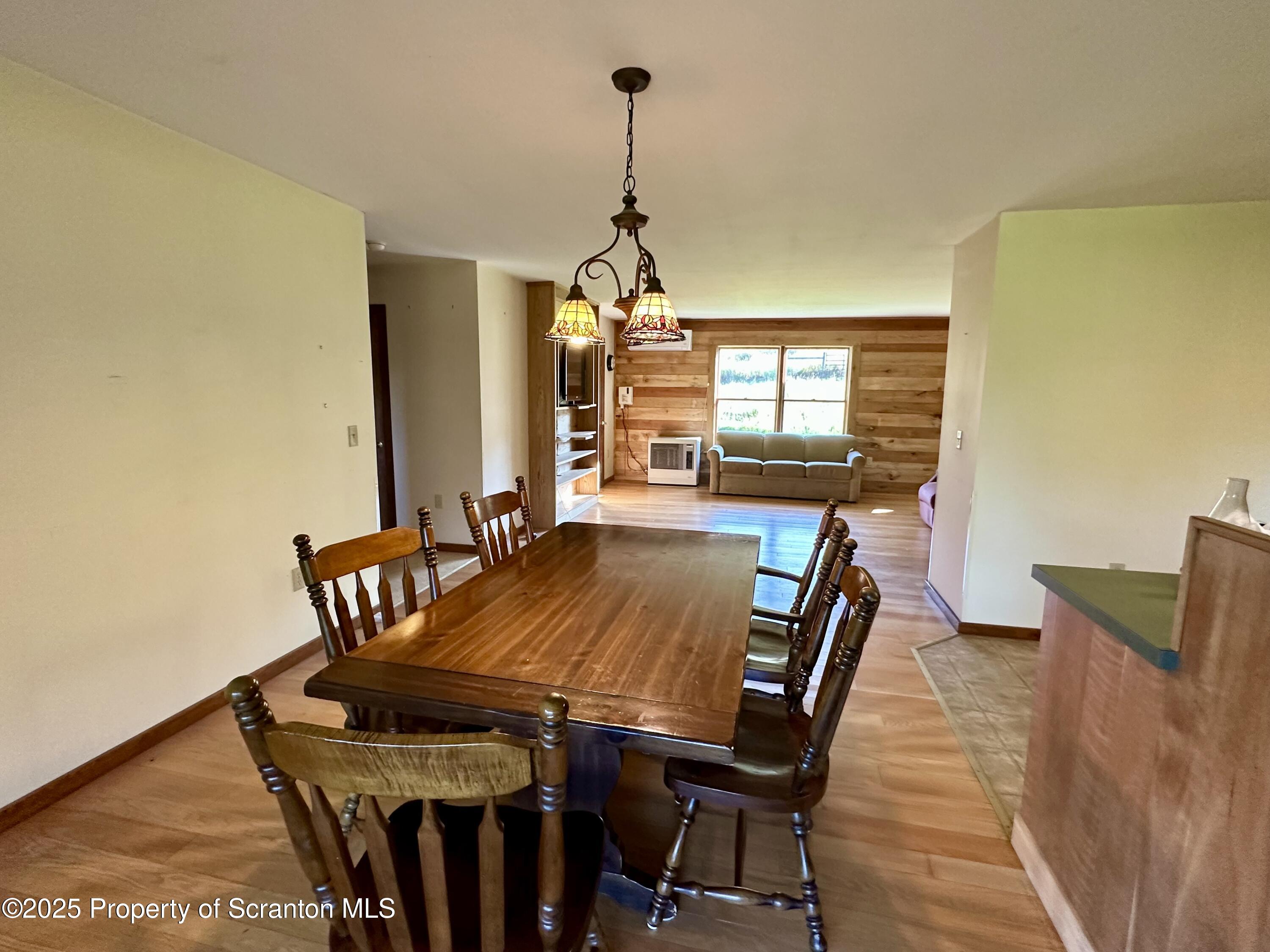 5290 Irish Hill Road Montrose, PA 18801 - Photo 22 of 67 a dining room with furniture and window