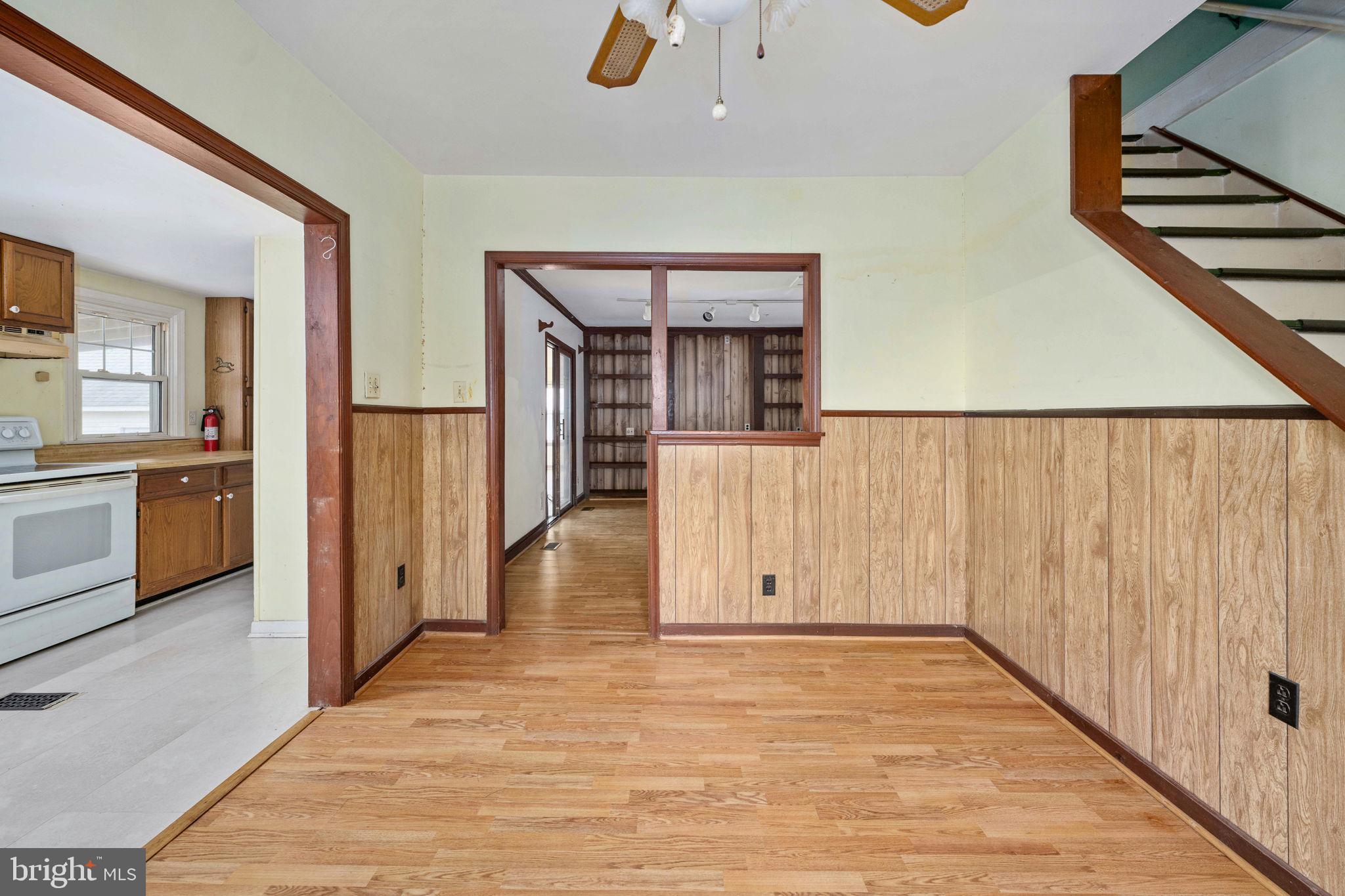 1881 Fairport Road Reedville, VA 22539 - Photo 26 of 57 a view of a hallway with wooden floor and staircase
