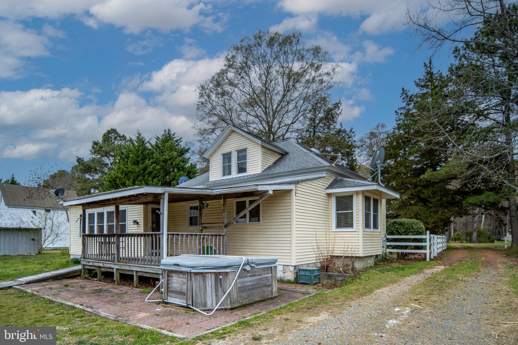 1881 Fairport Road Reedville, VA 22539 - Photo 47 of 57 a view of a house with a yard and sitting area