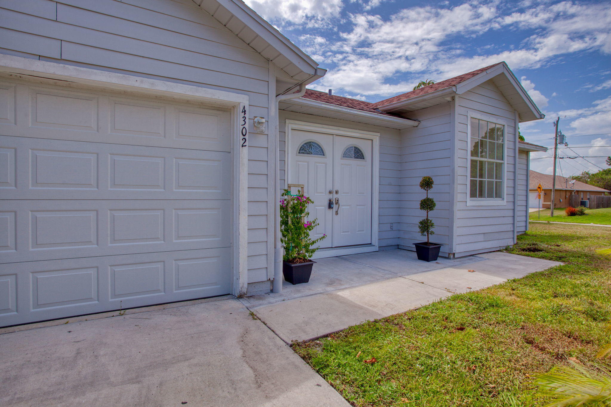 4302 Southwest Jaunt Road Port St. Lucie, FL 34953 - Photo 2 of 32 a view of a entryway door of the house
