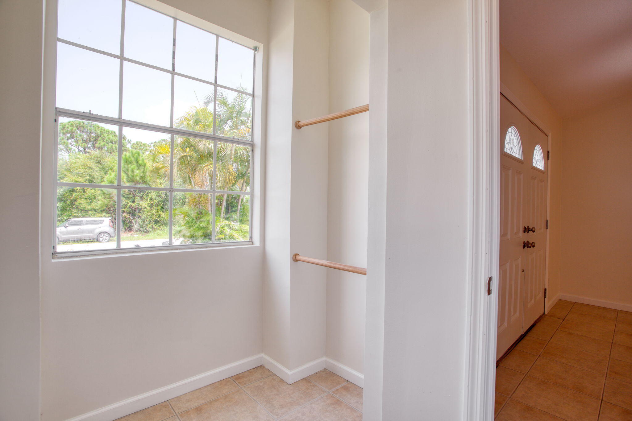 4302 Southwest Jaunt Road Port St. Lucie, FL 34953 - Photo 30 of 32 a view of an empty room with a window