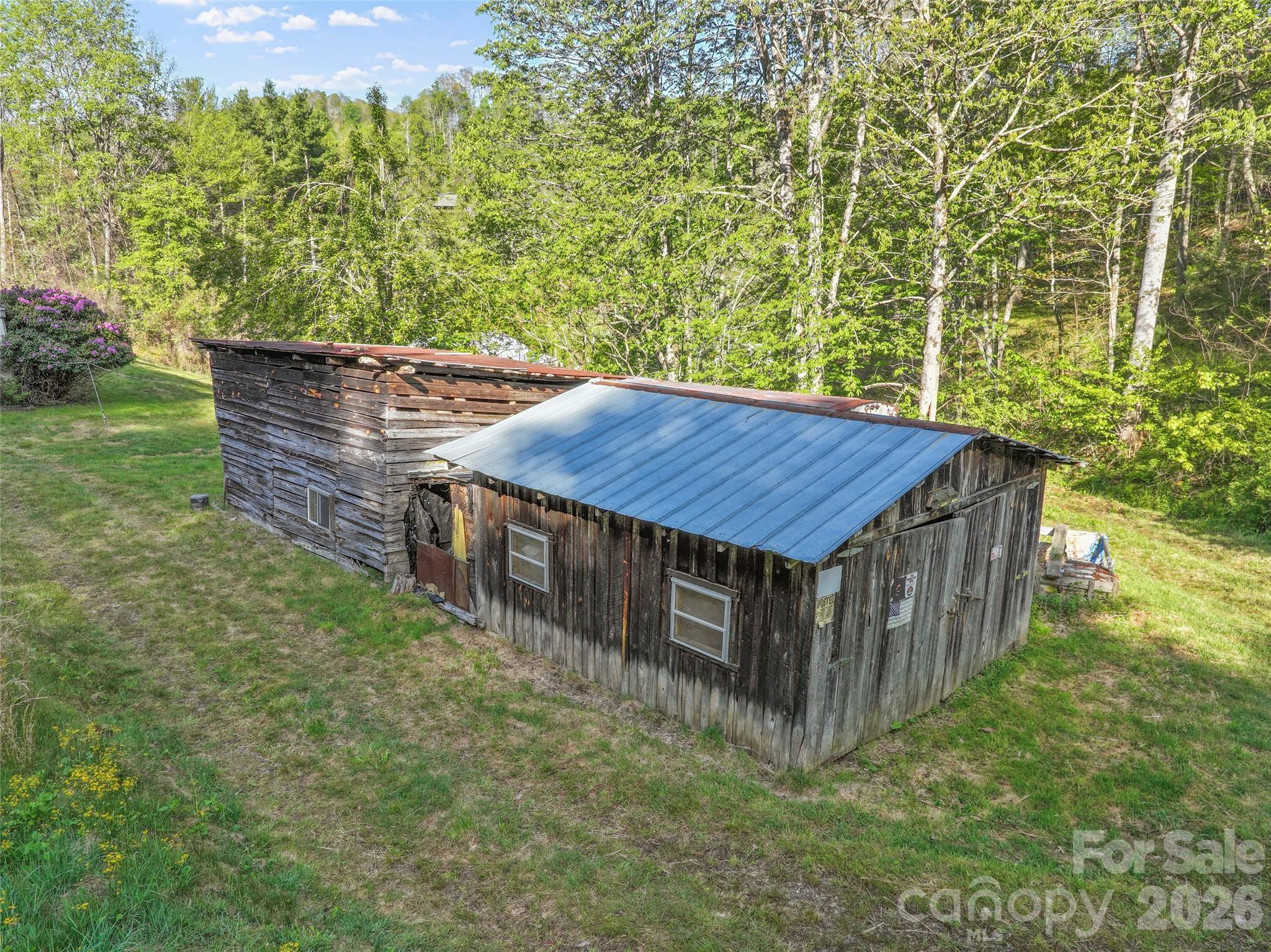 3454 Puncheon Fork Road Mars Hill, NC 28754 - Photo 15 of 18 a view of a wooden house with a yard