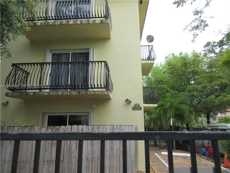 3090 Bird Avenue, Unit 203 Coconut Grove, FL 33133 - Photo 12 of 18 a view of a house with a balcony