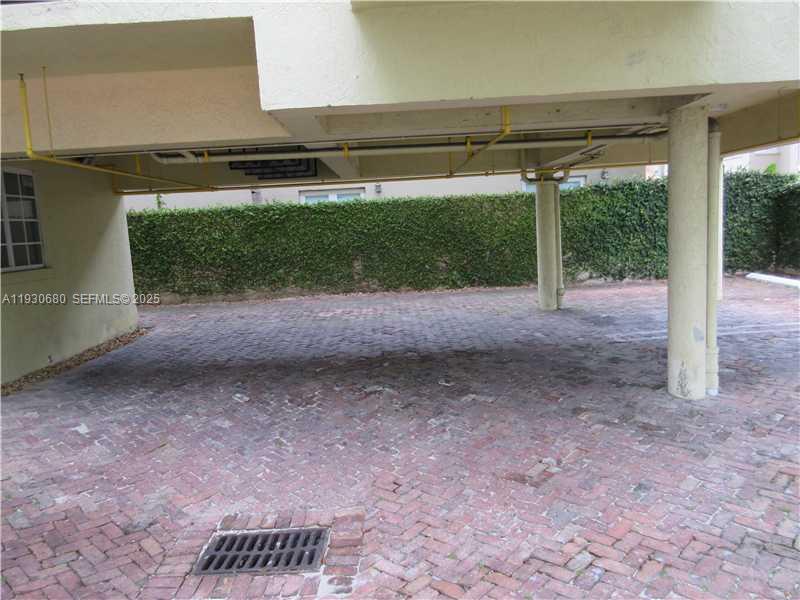 3090 Bird Avenue, Unit 203 Coconut Grove, FL 33133 - Photo 18 of 18 a view of a yard with porch