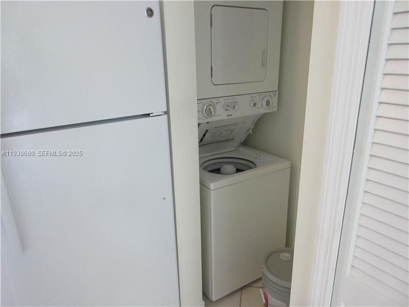 3090 Bird Avenue, Unit 203 Coconut Grove, FL 33133 - Photo 5 of 18 a utility room with dryer and washer