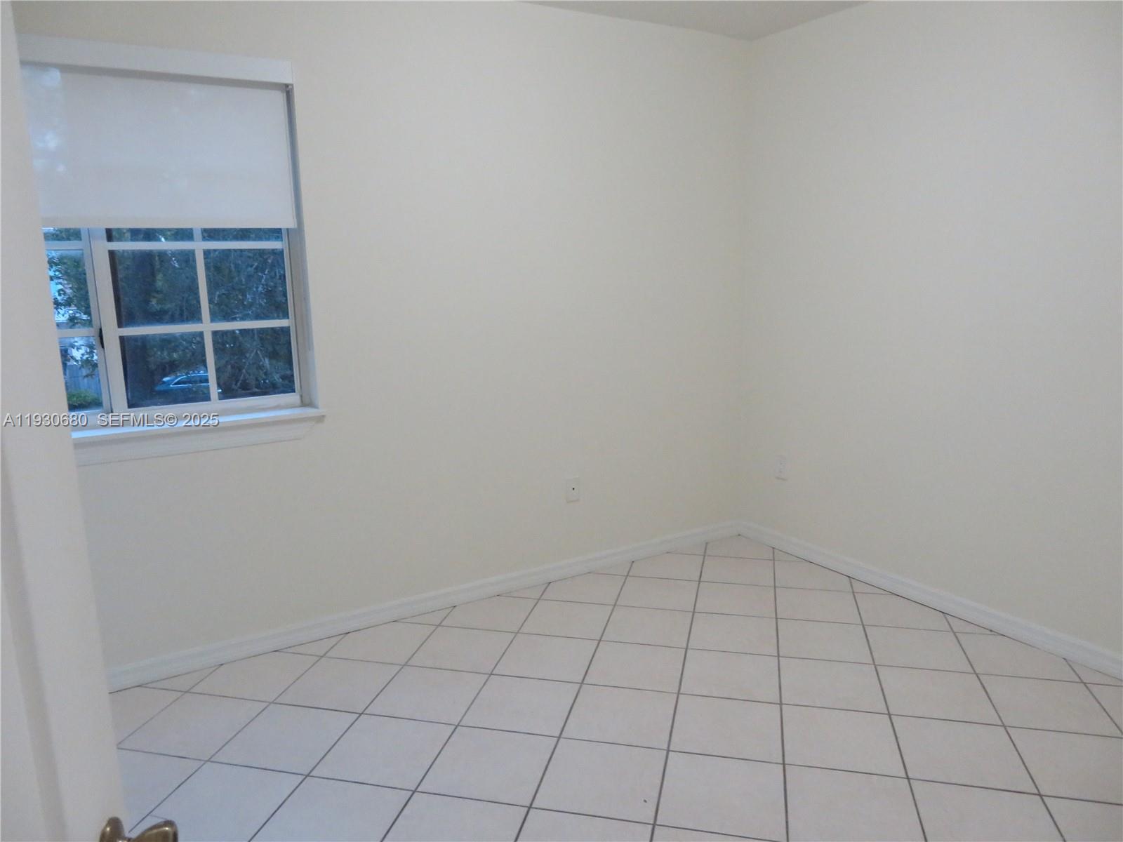 3090 Bird Avenue, Unit 203 Coconut Grove, FL 33133 - Photo 9 of 18 an empty room with windows