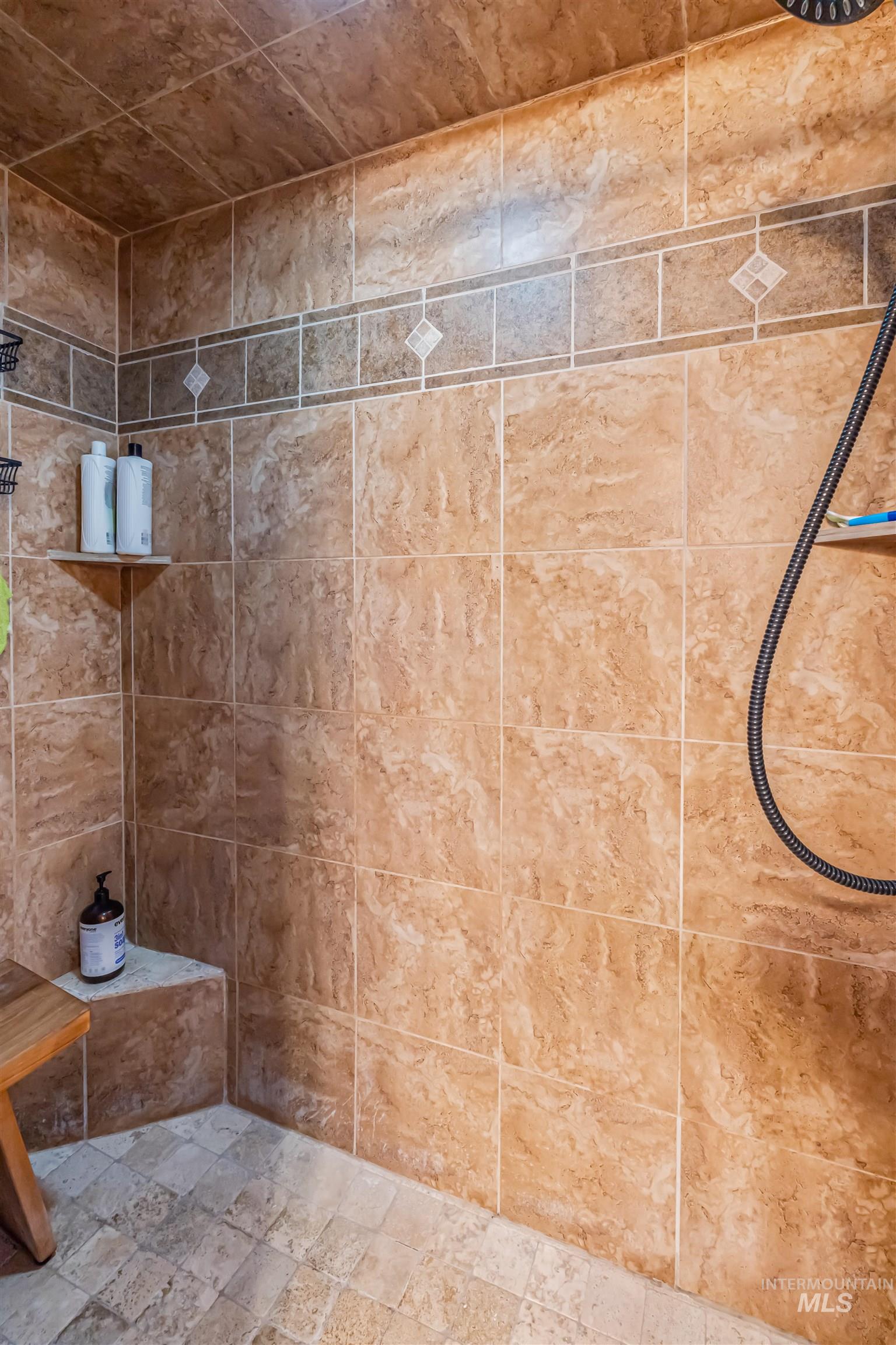 15 Rim Canyon Lane Boise, ID 83716 - Photo 13 of 31 Full bathroom featuring tiled shower and stone tile floors