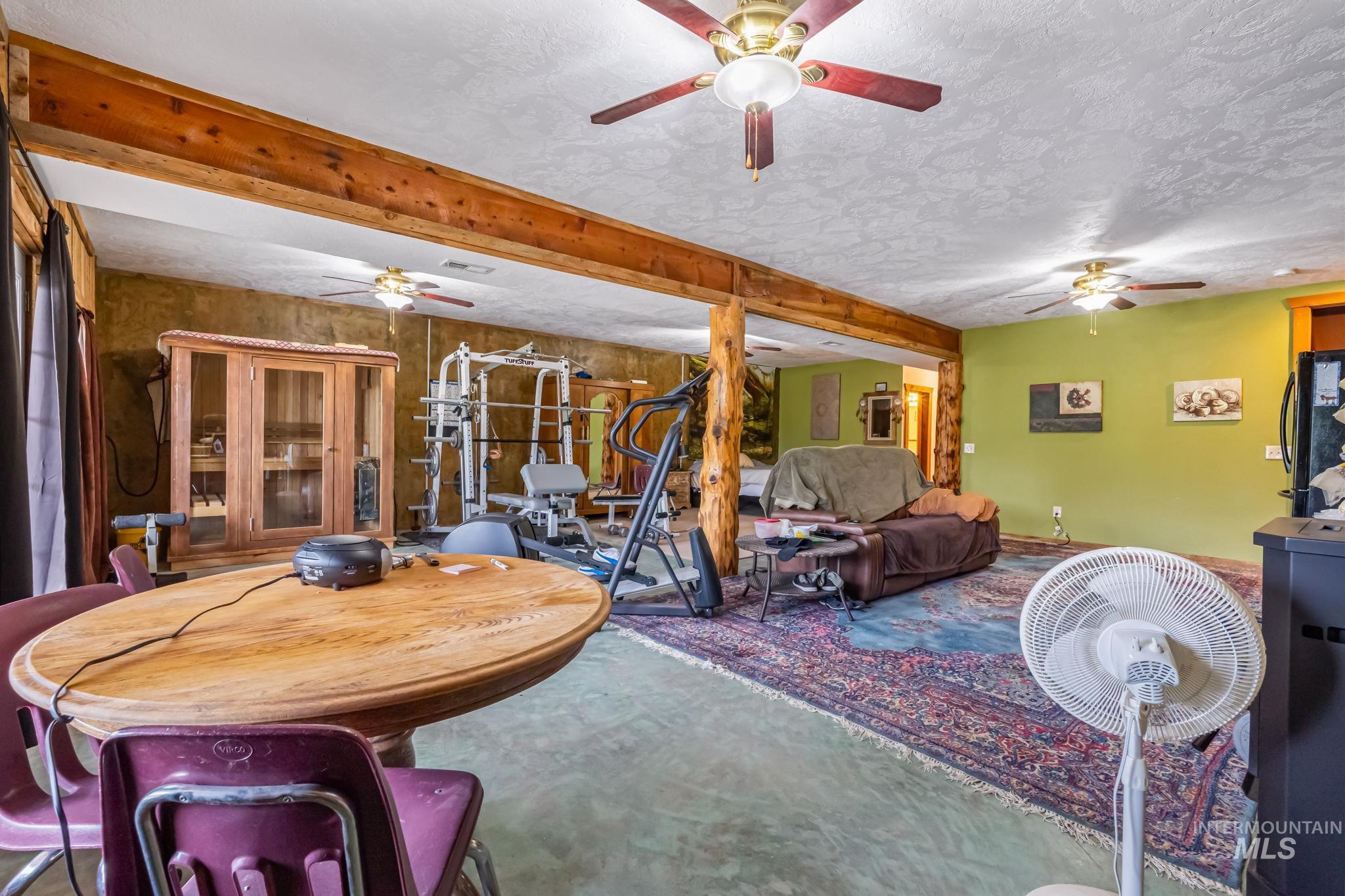 15 Rim Canyon Lane Boise, ID 83716 - Photo 17 of 31 Living area with a ceiling fan and a textured ceiling