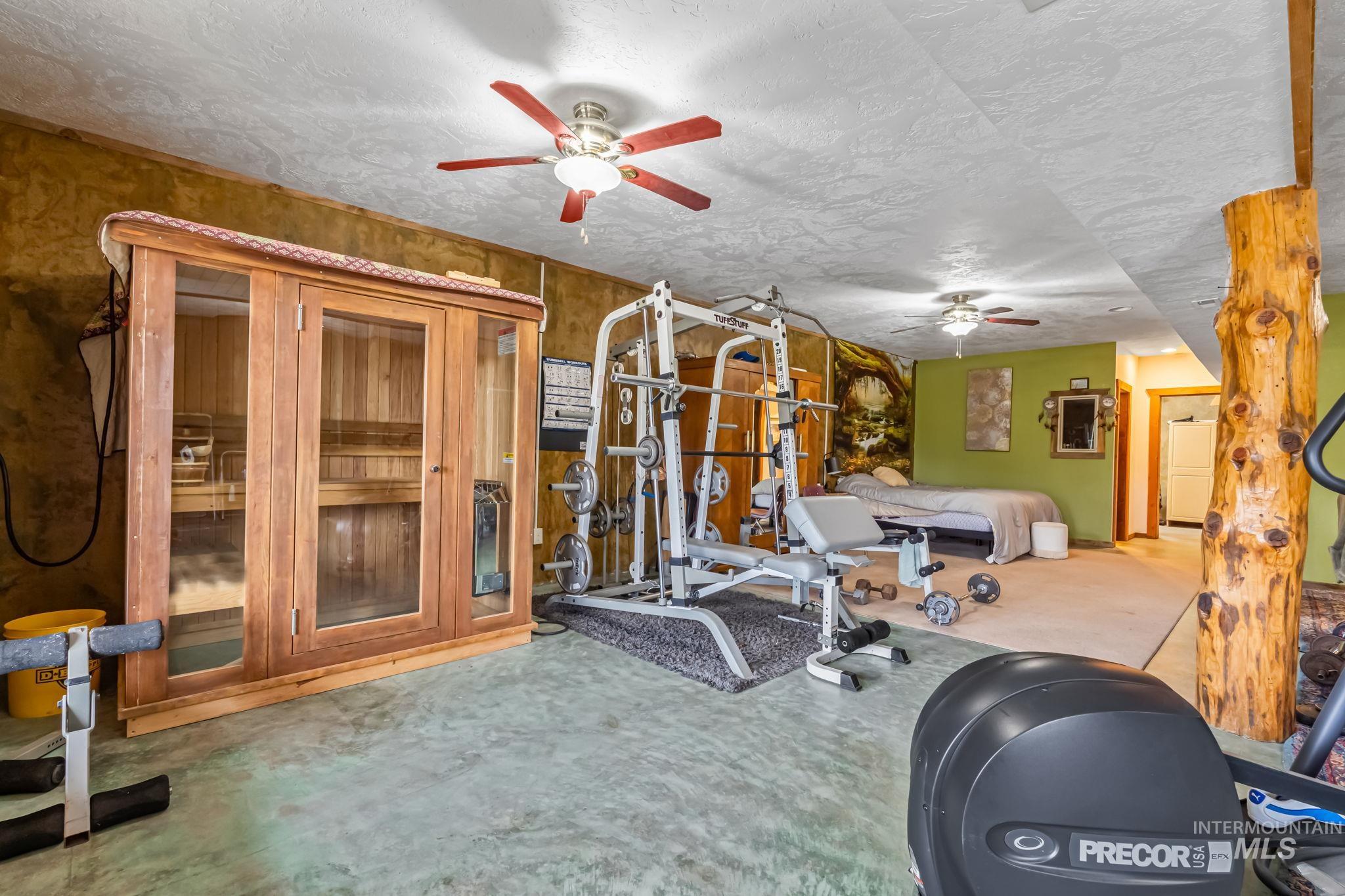 15 Rim Canyon Lane Boise, ID 83716 - Photo 18 of 31 Workout room featuring a sauna, a ceiling fan, and a textured ceiling