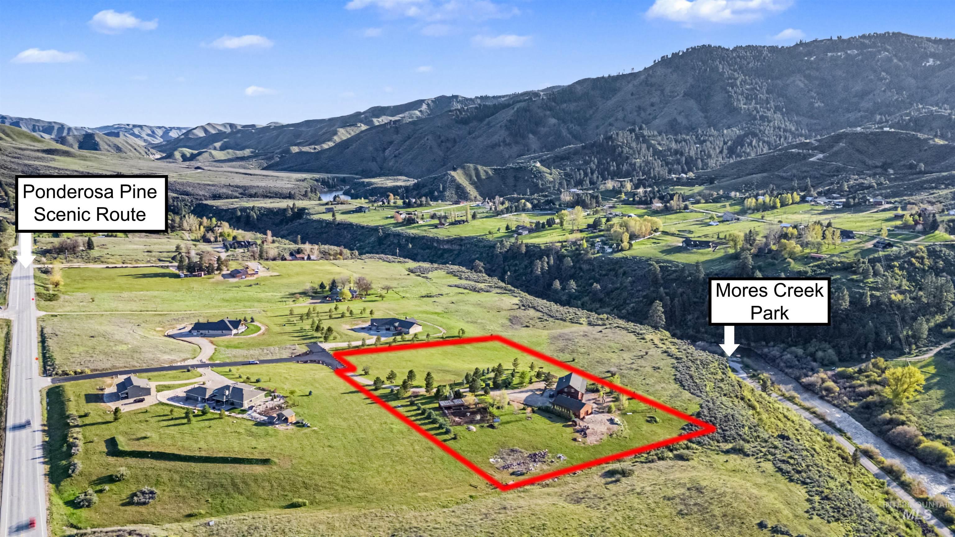 15 Rim Canyon Lane Boise, ID 83716 - Photo 29 of 31 Aerial view of property and surrounding area featuring property parcel outlined and mountains