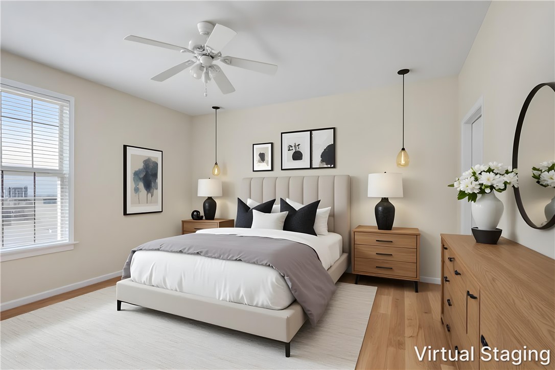 155 Life Style Lane Anderson, SC 29621 - Photo 4 of 49 Hardwood floors and generous natural light create an inviting atmosphere in this delightful bedroom.