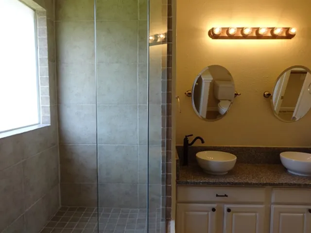 a bathroom with a sink and mirror