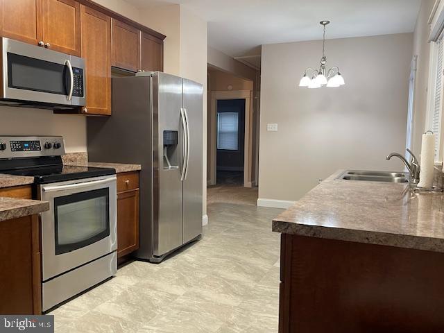 346 Coolidge Avenue Carneys Point, NJ 08069 - Photo 11 of 24 a kitchen with stainless steel appliances granite countertop a sink stove and refrigerator