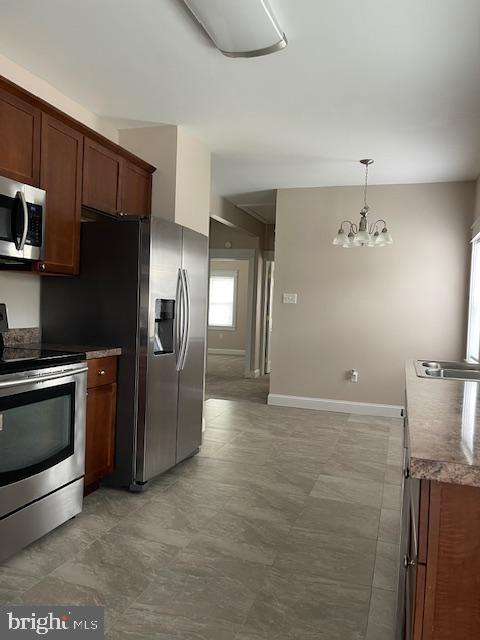 346 Coolidge Avenue Carneys Point, NJ 08069 - Photo 12 of 24 a view of a kitchen with a sink and stainless steel appliances