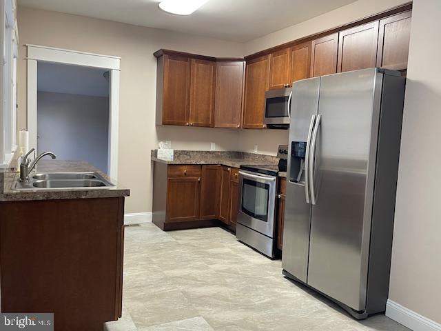 346 Coolidge Avenue Carneys Point, NJ 08069 - Photo 14 of 24 a kitchen with stainless steel appliances granite countertop a refrigerator a stove and a sink