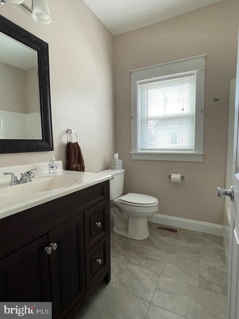 346 Coolidge Avenue Carneys Point, NJ 08069 - Photo 16 of 24 a bathroom with a toilet sink and mirror