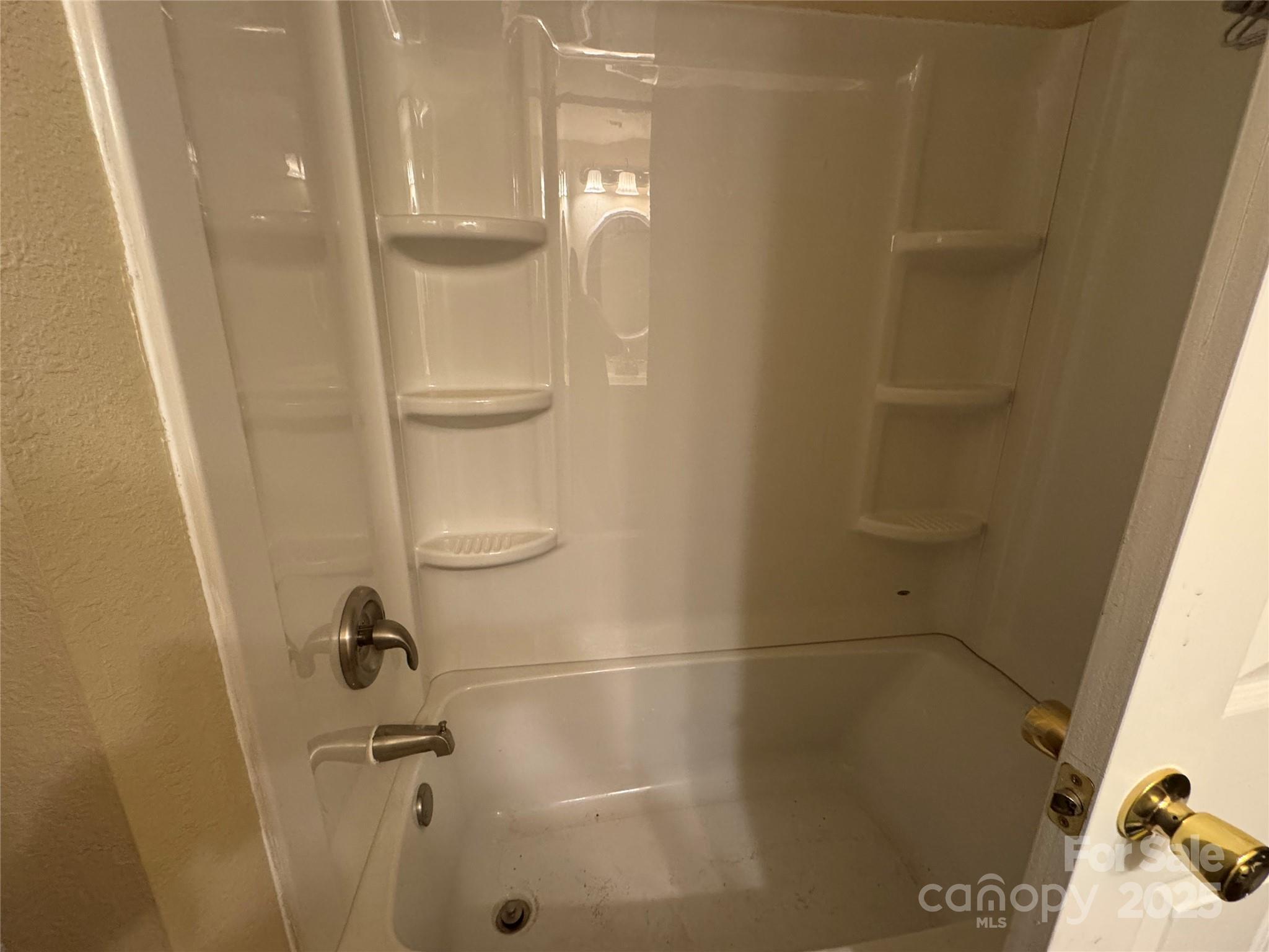 423 Crocus Lane Sylva, NC 28779 - Photo 5 of 10 a bathroom with a glass shower door