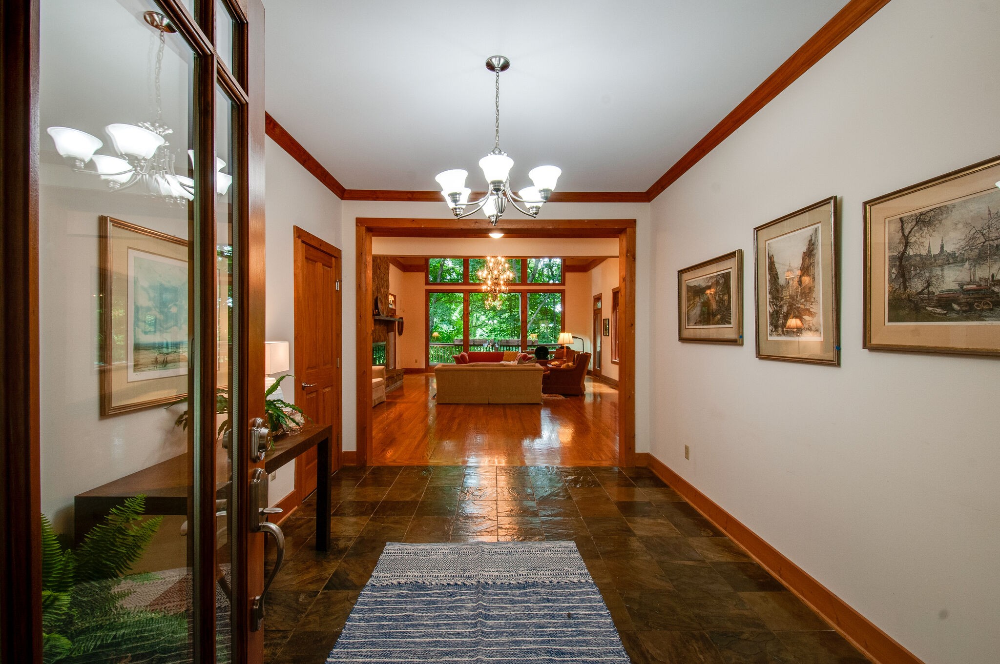 438 Grayson Drive Nashville, TN 37205 - Photo 3 of 36 a hallway with wooden floor chandelier and livingroom view