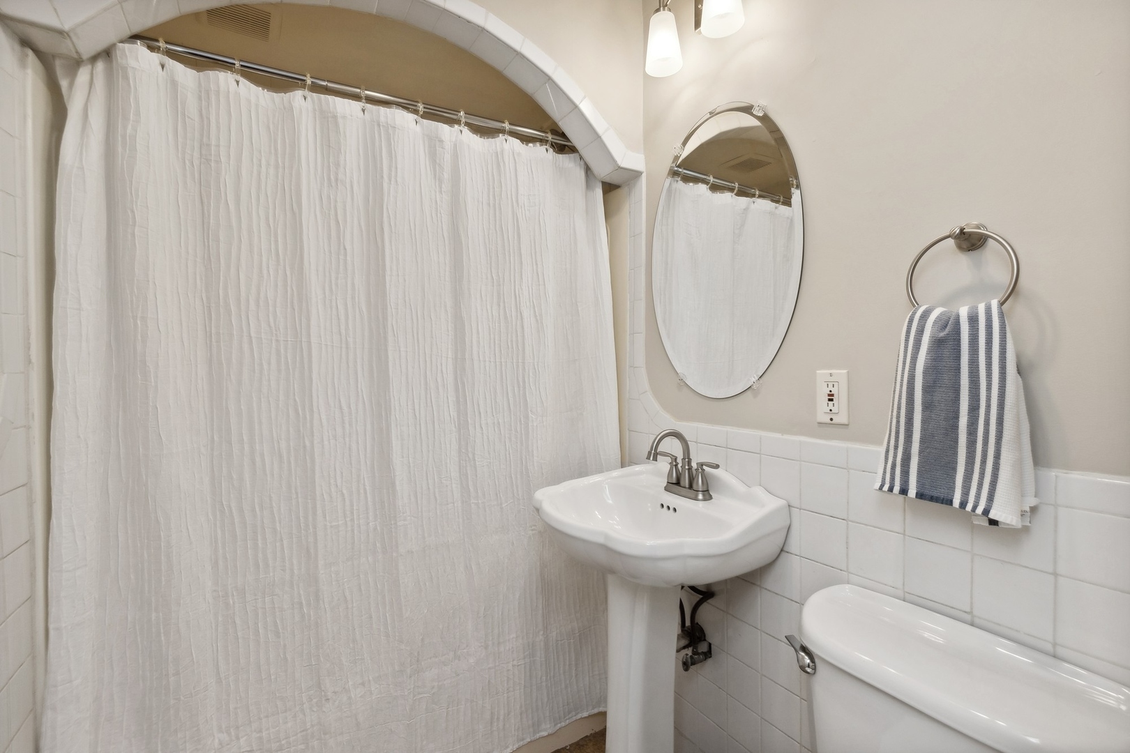 33423 North Mill Road Grayslake, IL 60030 - Photo 11 of 22 a bathroom with a sink a light fixture and a mirror