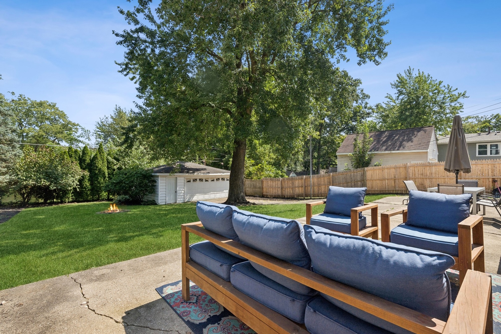 33423 North Mill Road Grayslake, IL 60030 - Photo 15 of 22 a view of a patio with couches chairs and a big yard