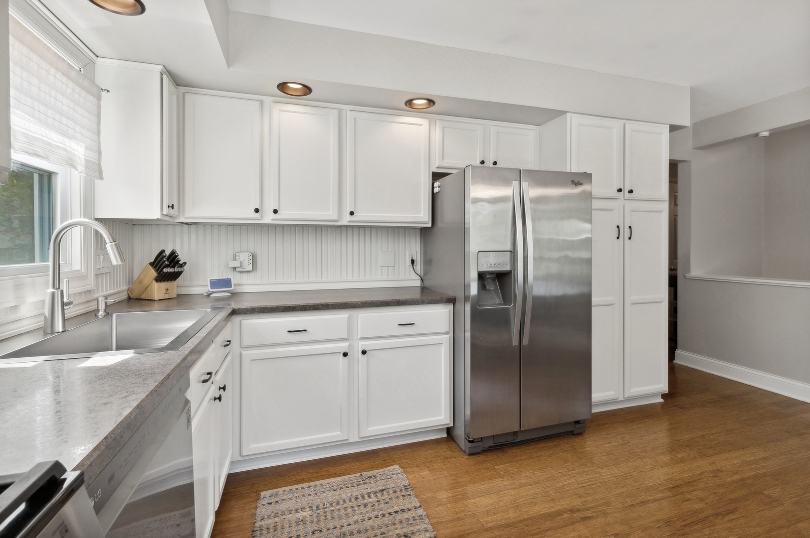 33423 North Mill Road Grayslake, IL 60030 - Photo 3 of 22 a kitchen with a refrigerator sink and cabinets